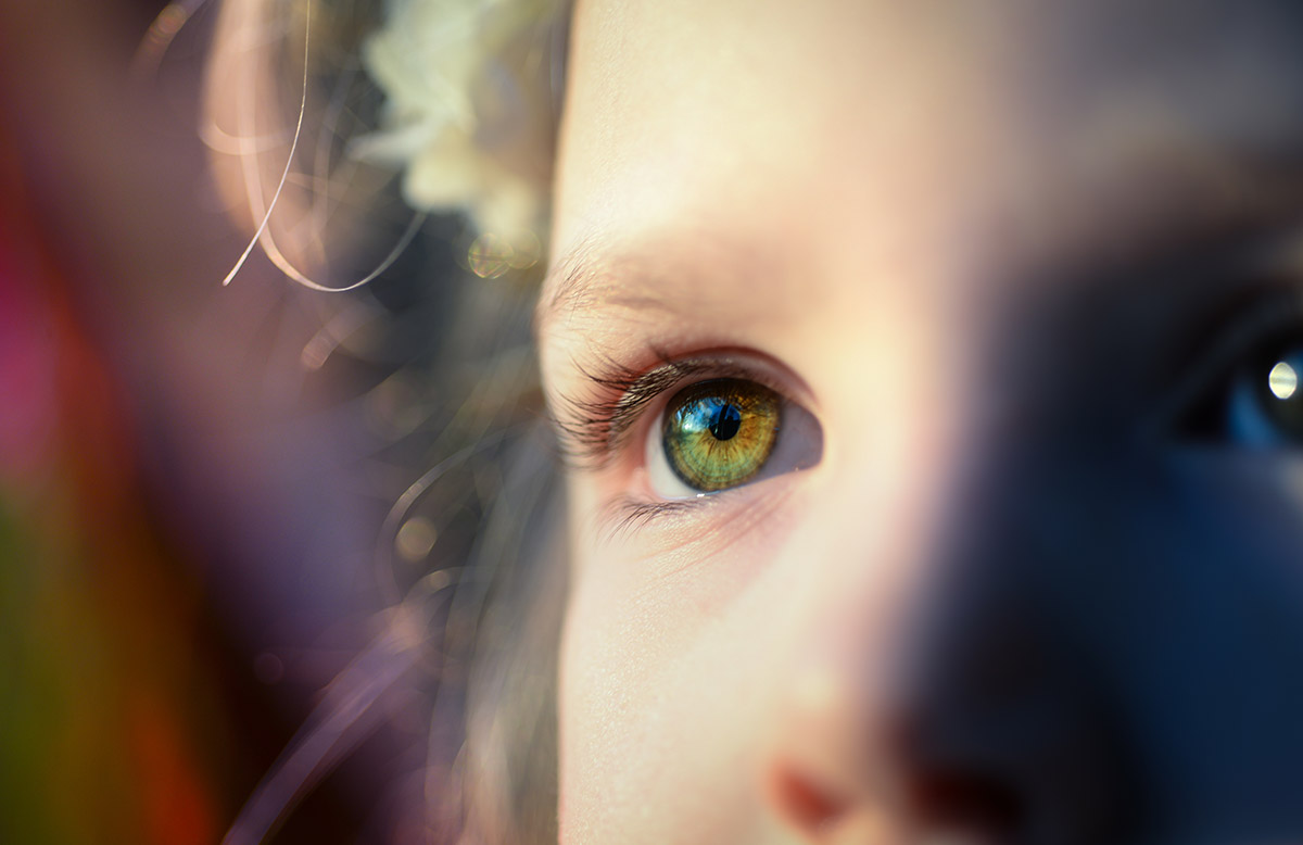 a closeup of a child's green eye