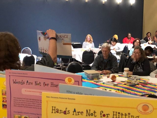 A presentation hall filled with teachers