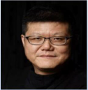 An Asian man wearing glasses and a black sweater