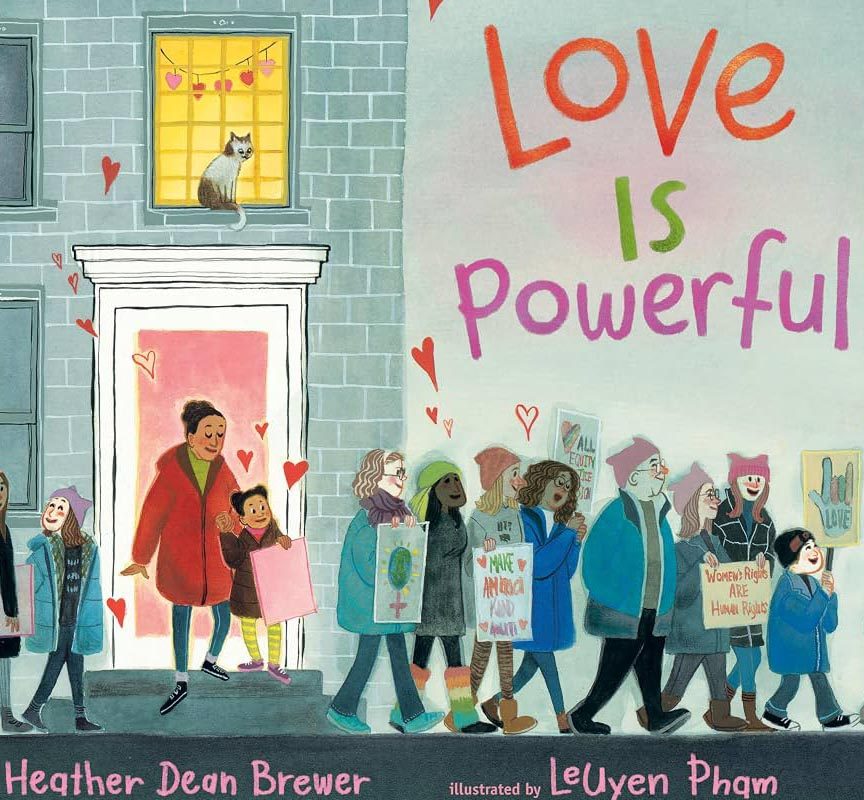 Illustrated book cover of Love is Powerful. A young girl and her mother walk out their front door to join peaceful protesters on the sidewalk. Everyone is holding signs about peace.