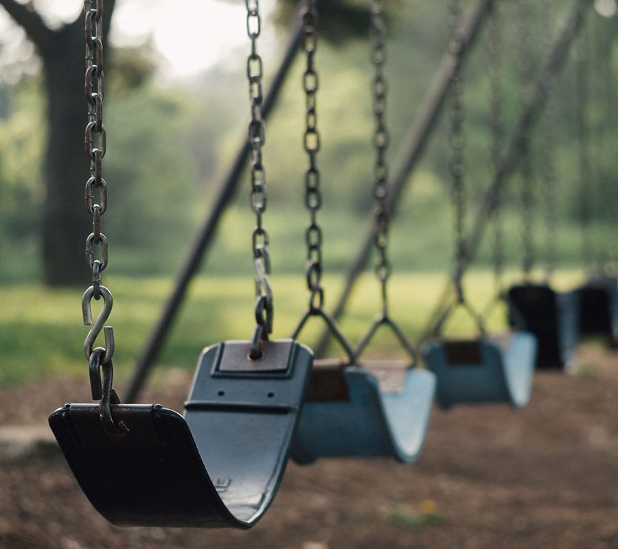 Empty swings in a public park