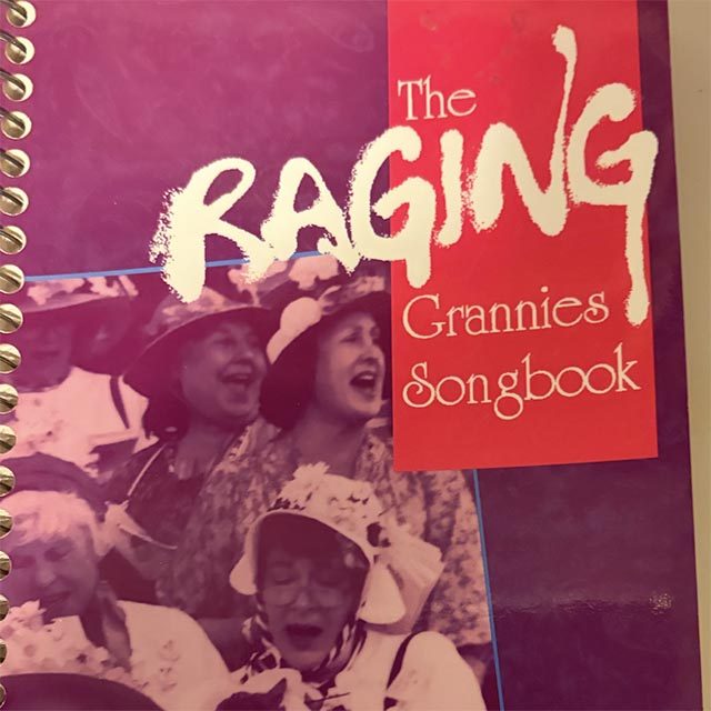 Cover of The Raging Grannies Songbook. The image depicts older women in festive sun hats adorned with flowers.