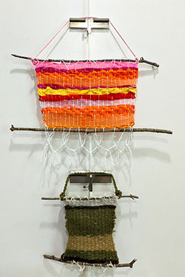 2 weavings on a gallery wall