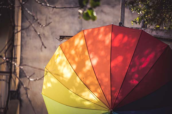 Looking downward over a rainbow umbrella